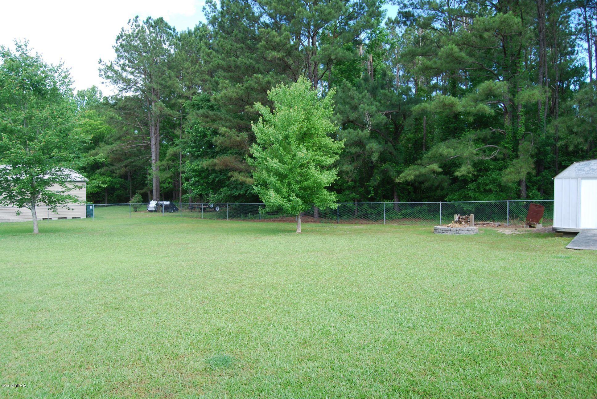 113 Marcar Road Macon, GA 31216 - Photo 25 of 31 a backyard of a house with lots of green space