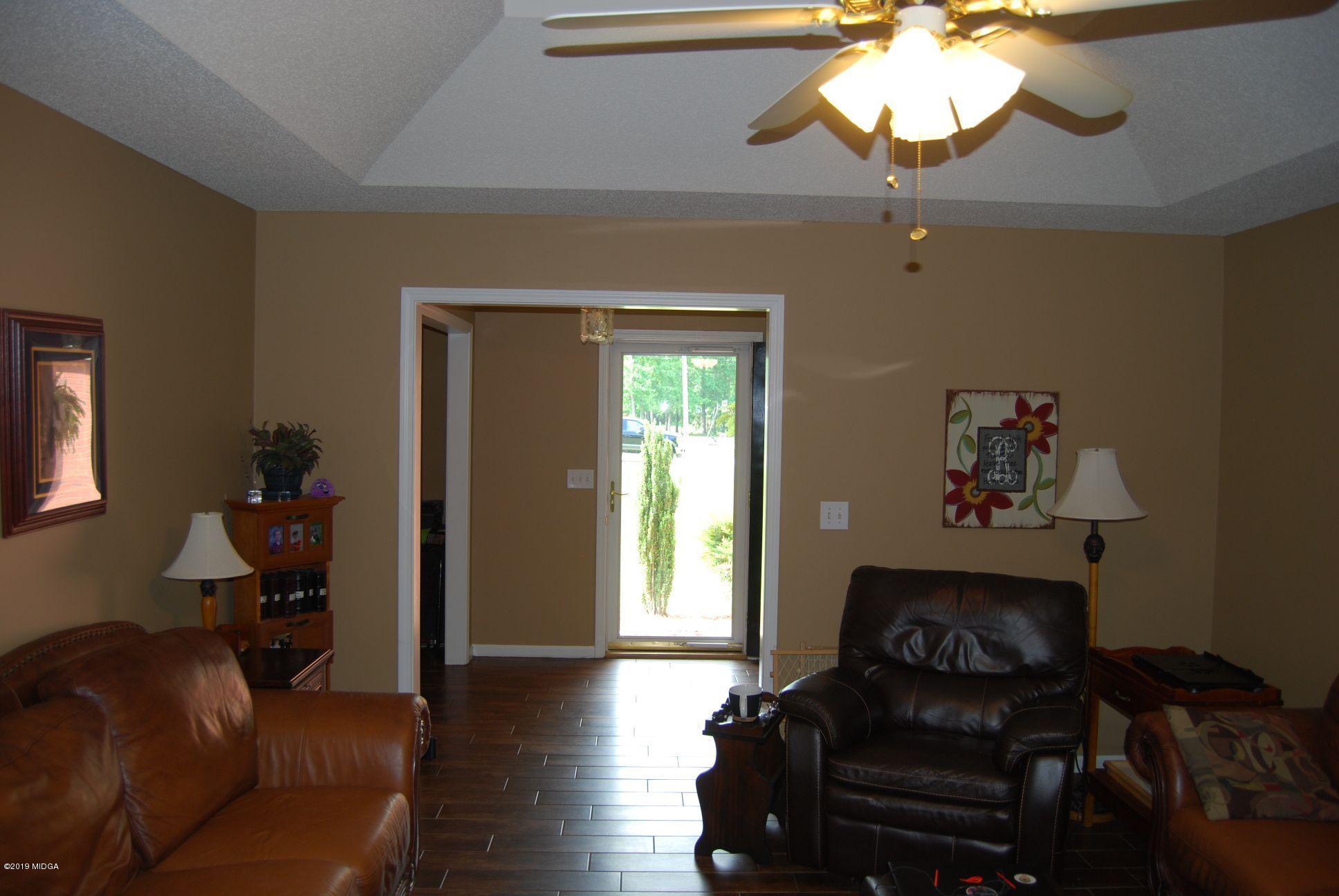 113 Marcar Road Macon, GA 31216 - Photo 4 of 31 a living room with furniture and a fireplace