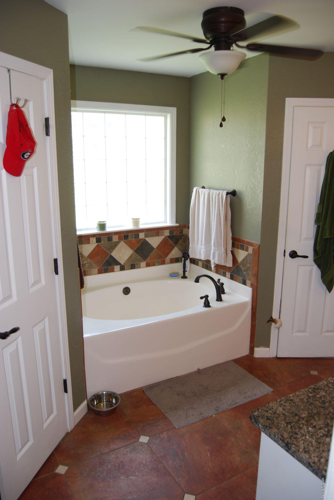 113 Marcar Road Macon, GA 31216 - Photo 10 of 31 a bathroom with a bathtub and a shower
