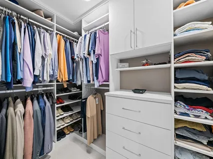 a bathroom with a tub a sink and a mirror