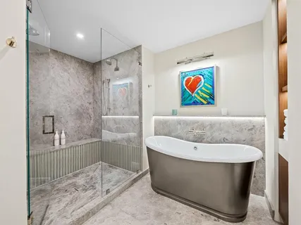 a view of swimming pool with a lounge chairs