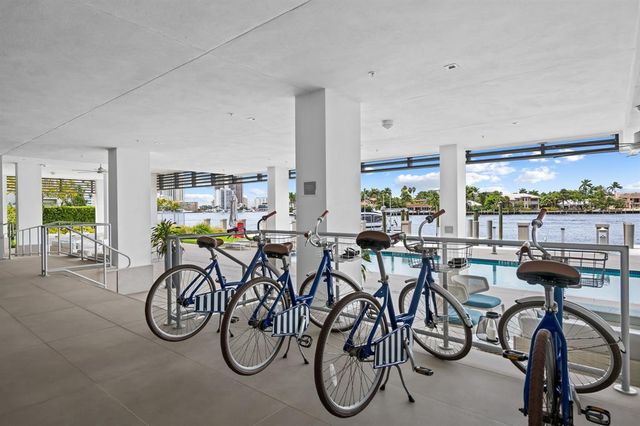 a view of a swimming pool with outdoor seating