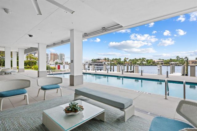 a view of a chairs and table in a terrace