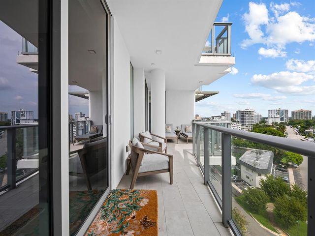 a view of a balcony with furniture