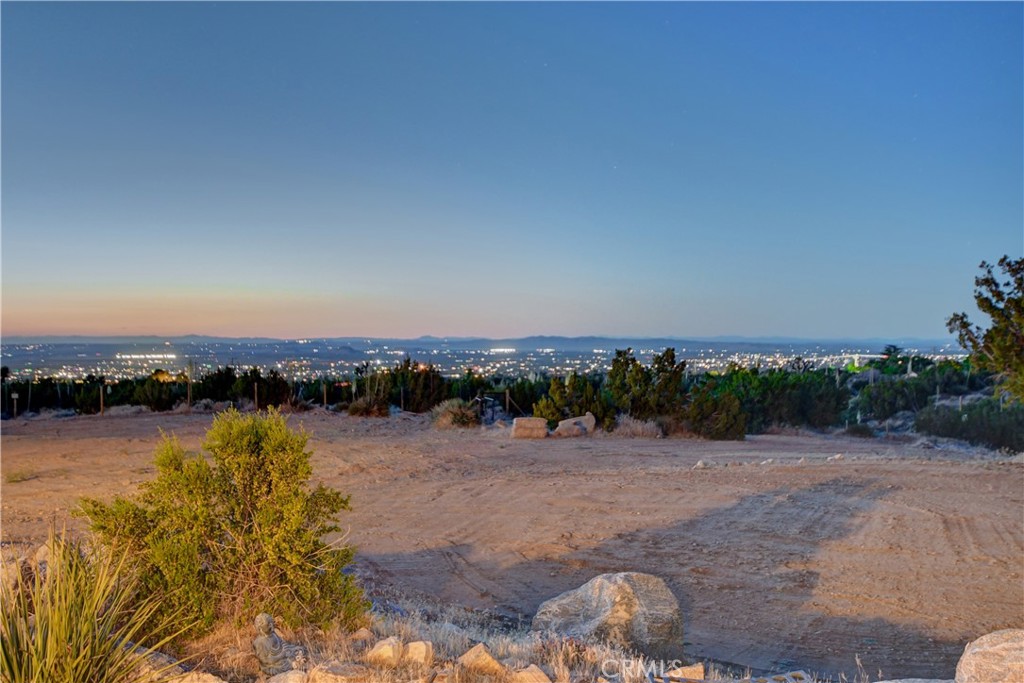 1330 Tamarack Road Pinon Hills, CA 92372 - Photo 15 of 19 a view of a lake with houses in the back