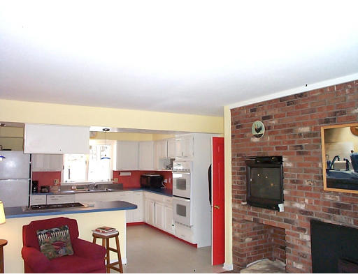237 North Valley Road Pelham, MA 01002 - Photo 3 of 5 a kitchen with stainless steel appliances kitchen island granite countertop a refrigerator and a stove top oven