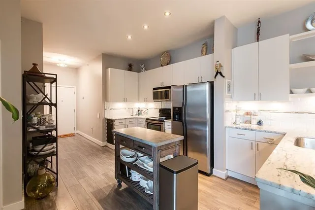 a living room with furniture fireplace and flat screen tv