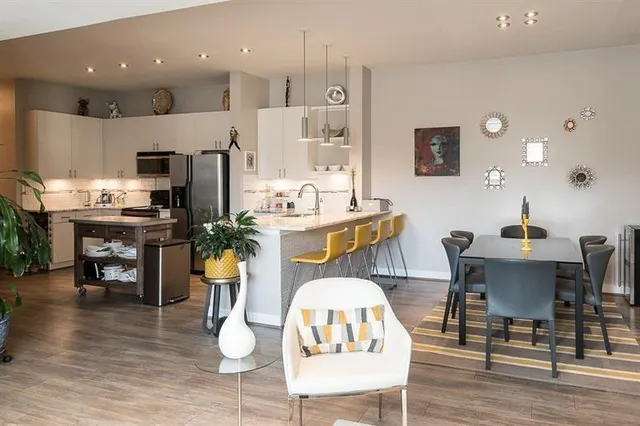 a view of a dining room with furniture and wooden floor