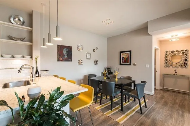 a view of a livingroom with furniture and wooden floor