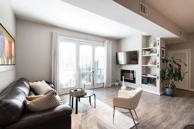a view of washer and dryer with kitchen in the background