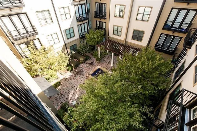a view of a patio with a dining table and chairs