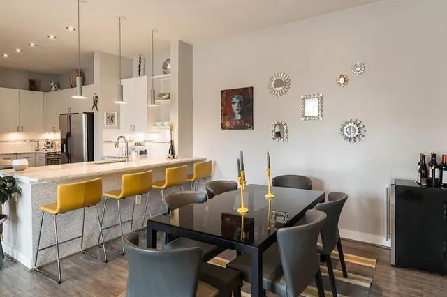a view of a dining room with furniture and wooden floor