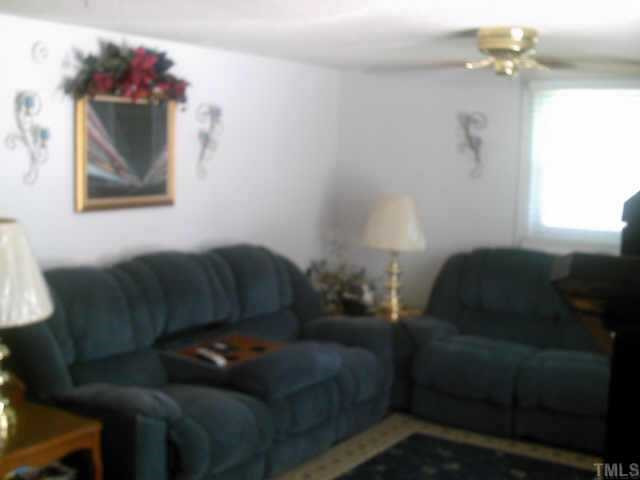 209 Kennedy Street Raleigh, NC 27610 - Photo 5 of 8 Relax in the family room near the cozy gas-log fireplace. Other