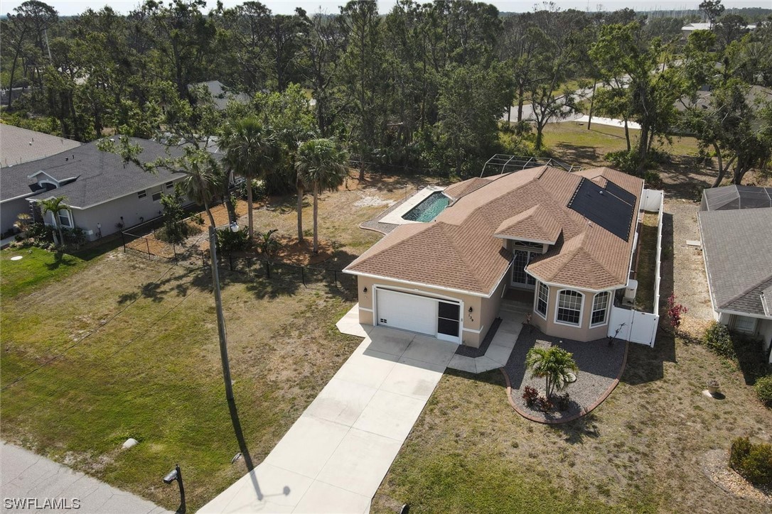 an aerial view of a house with a garden