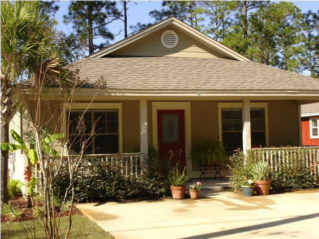 87 Indian Woman Road Santa Rosa Beach, FL 32459 - Photo 2 of 14 front view of a house with a yard