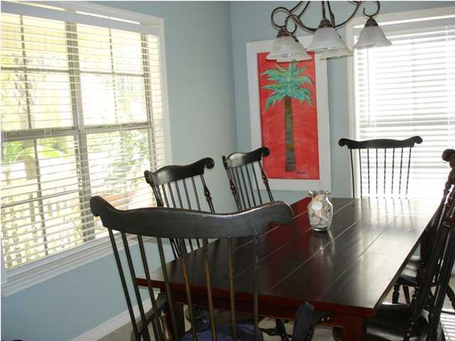 87 Indian Woman Road Santa Rosa Beach, FL 32459 - Photo 4 of 14 a view of a dining room with furniture window and outside view