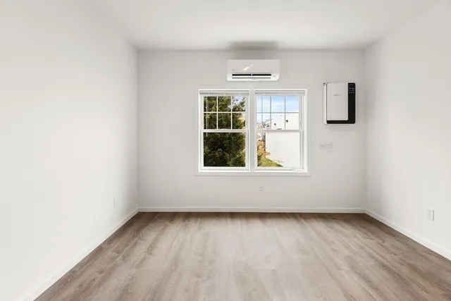 a white toilet sitting next to a shower