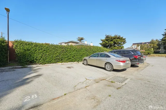 a view of a car parked on the side of the road