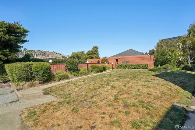 a view of a road with a building in the background