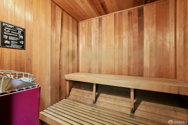 a view of a room with wooden floor and chair
