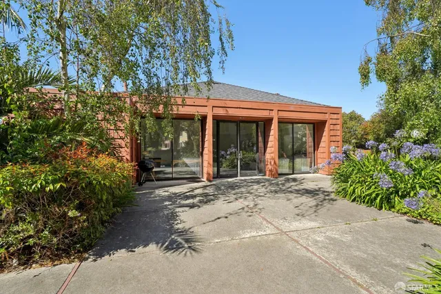 front view of a house with a garden