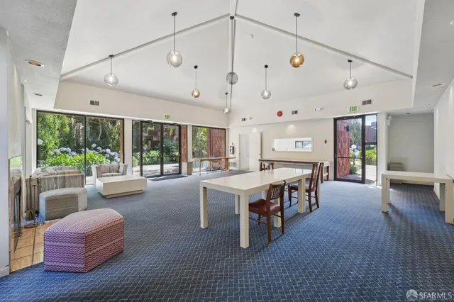 a large kitchen with a table and chairs