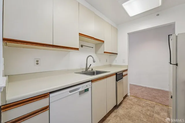 a kitchen with a sink and cabinets