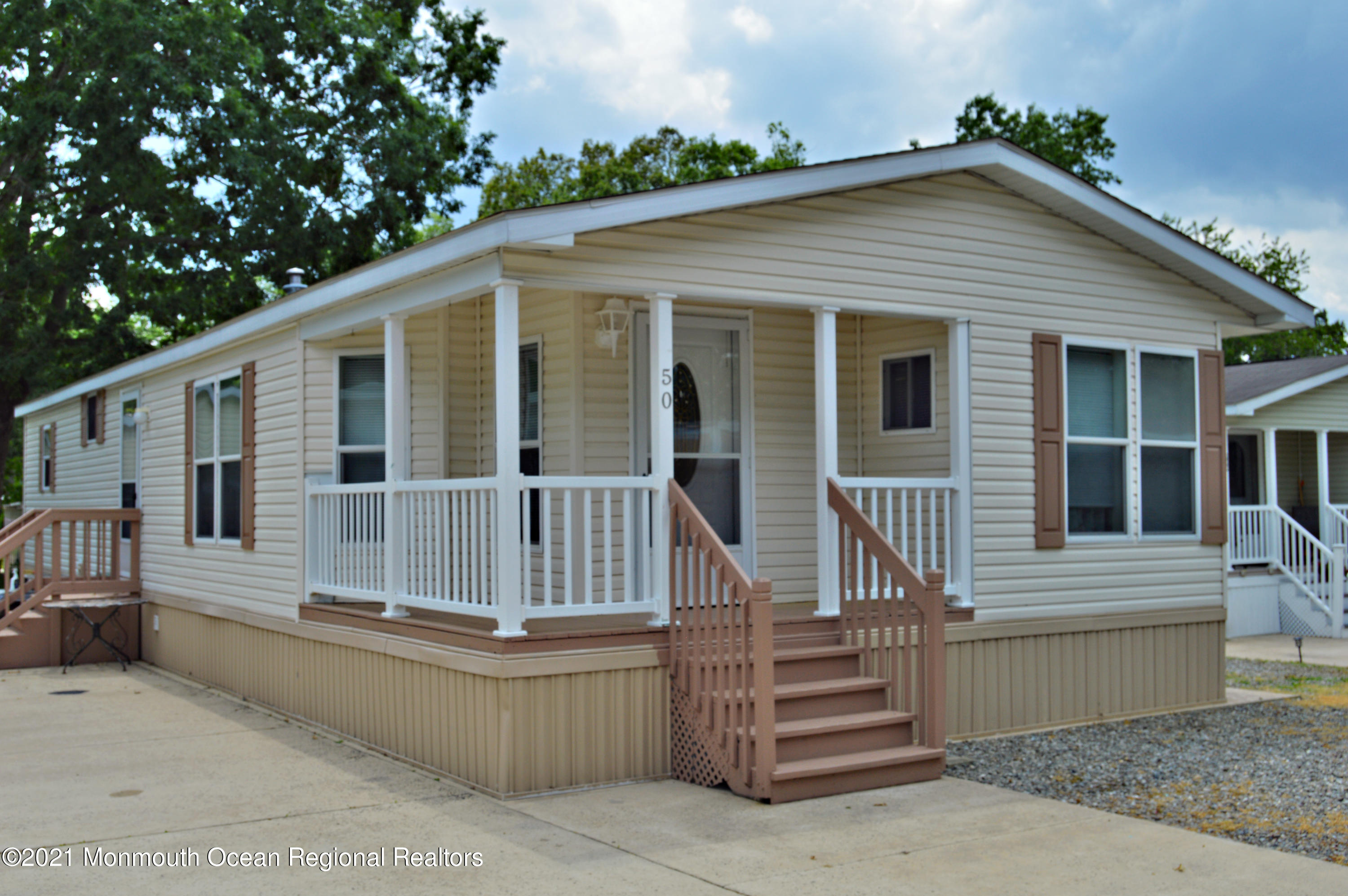 50 Roberts Road Toms River, NJ 08755 - Photo 1 of 23 front view of a house with a porch