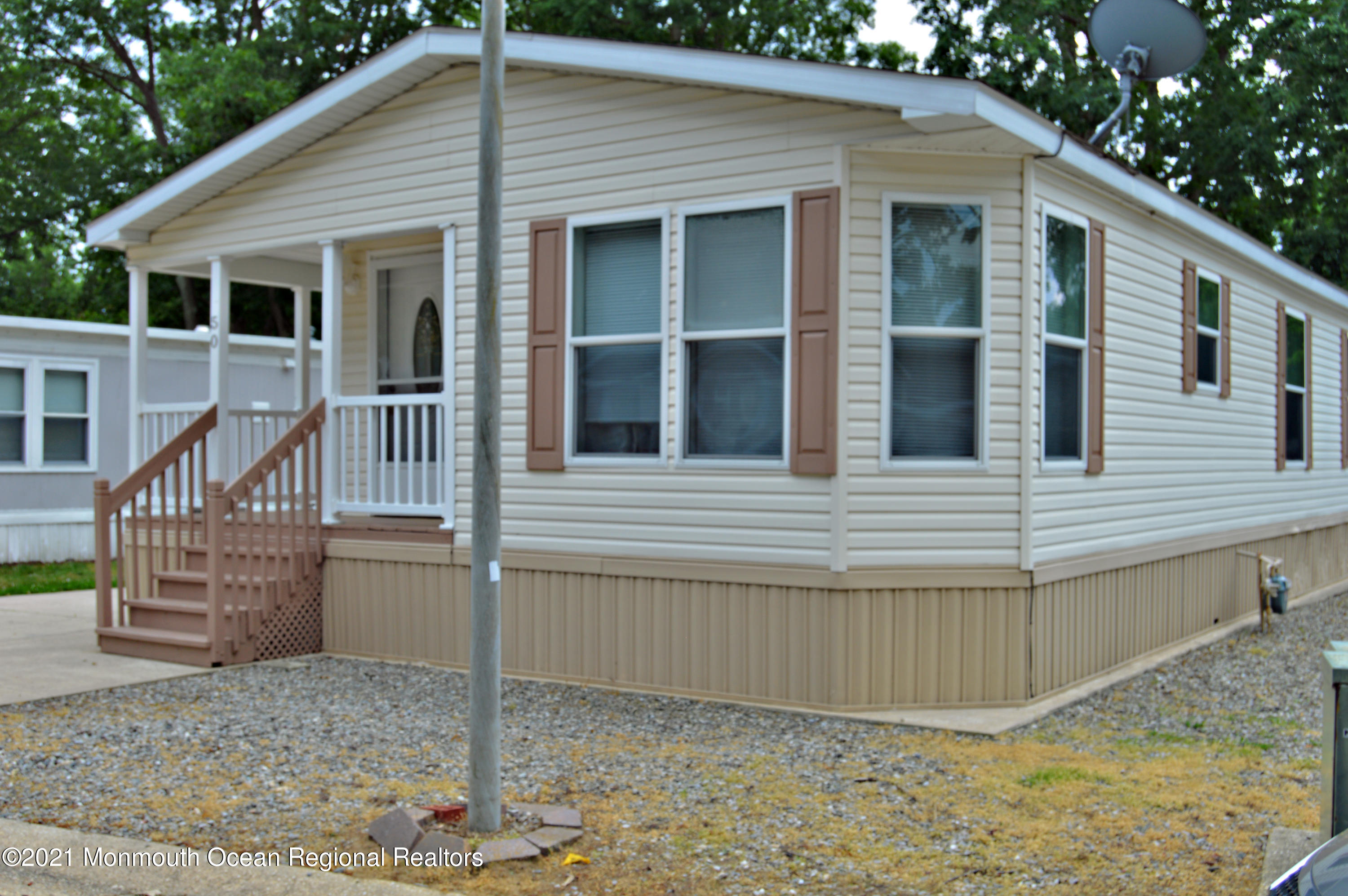 50 Roberts Road Toms River, NJ 08755 - Photo 2 of 23 a view of a house with a small yard and wooden fence