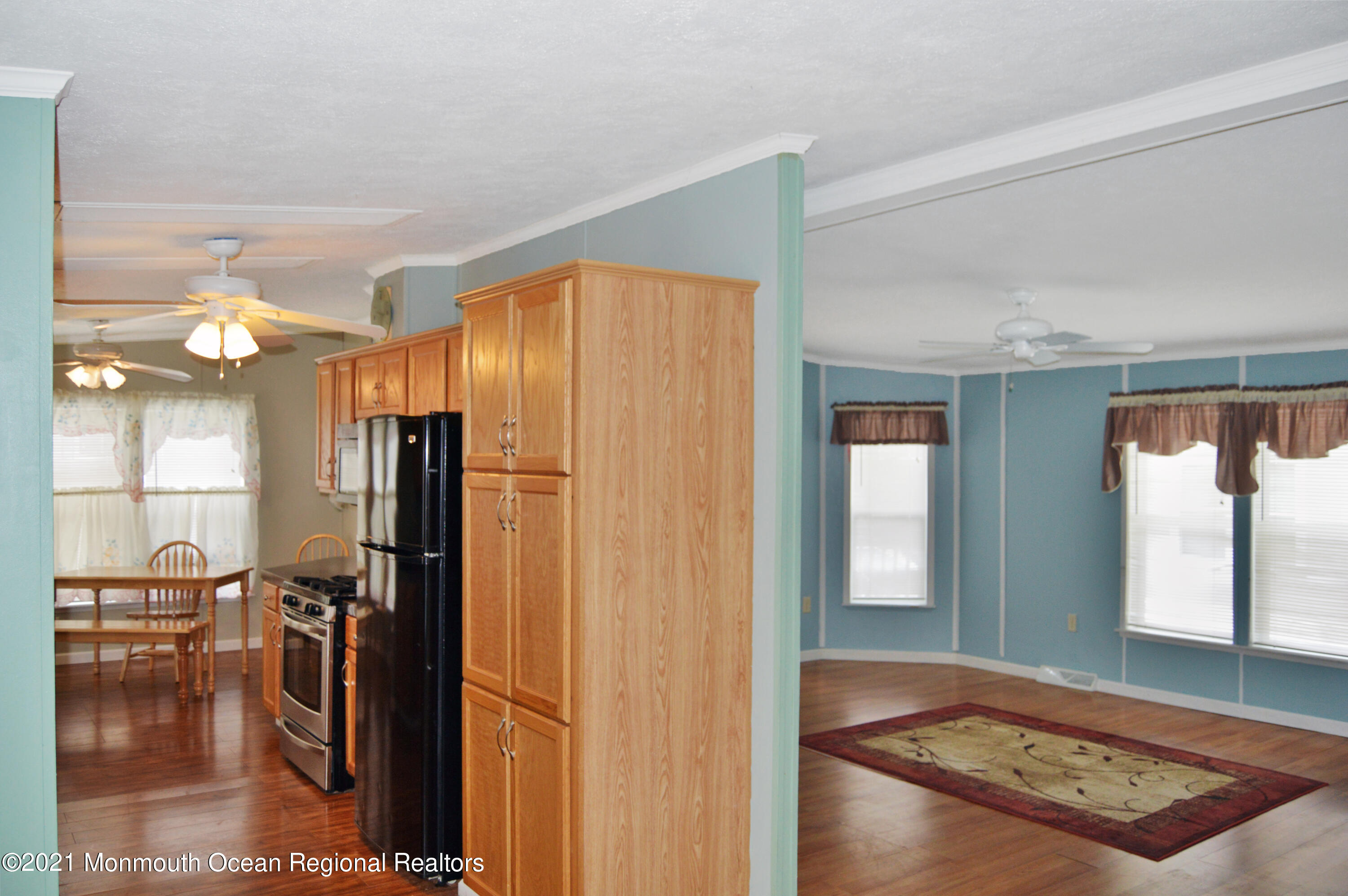 50 Roberts Road Toms River, NJ 08755 - Photo 11 of 23 a view of a hallway with dining area and chandelier