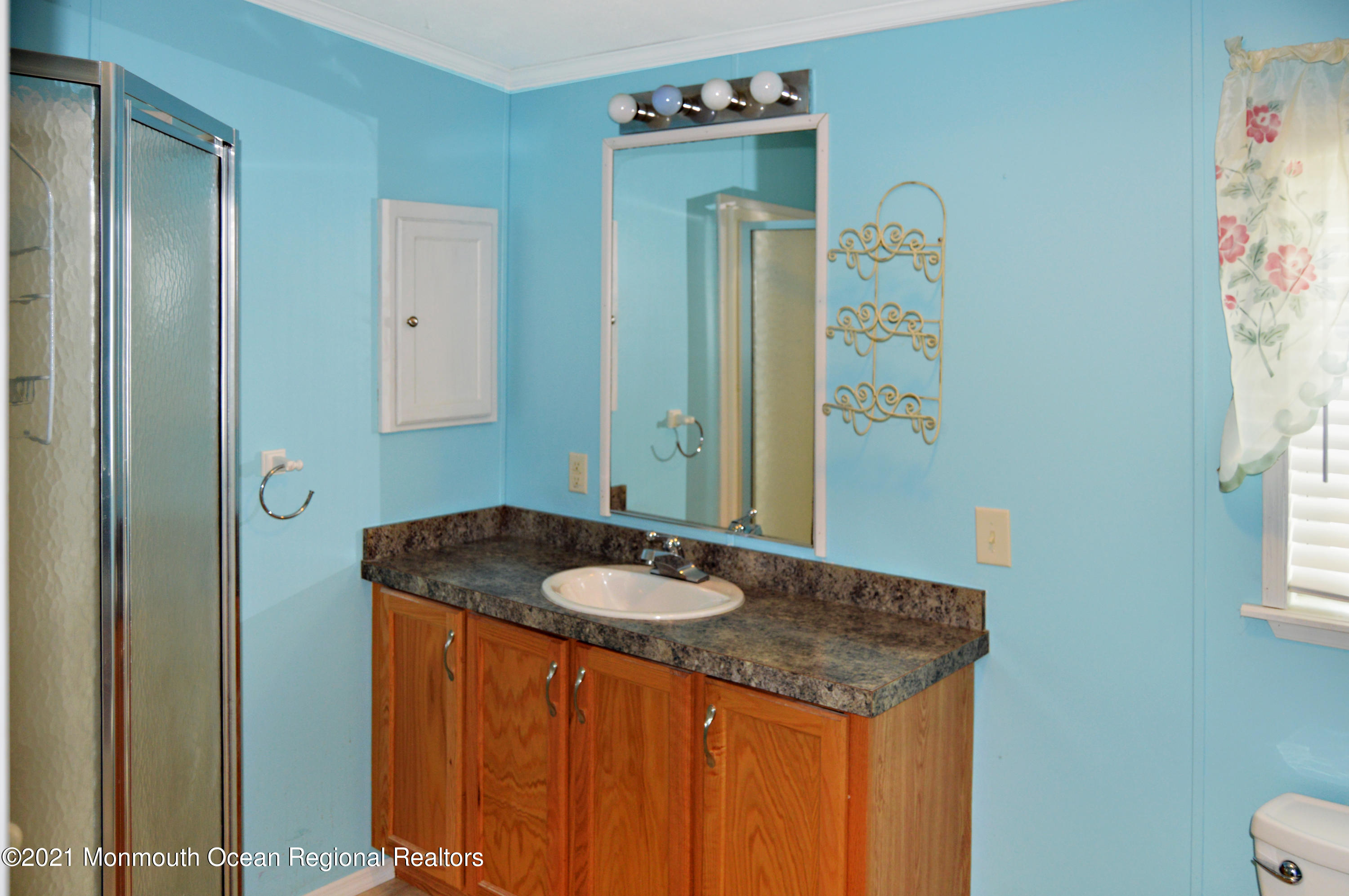 50 Roberts Road Toms River, NJ 08755 - Photo 19 of 23 a bathroom with a granite countertop sink and a mirror