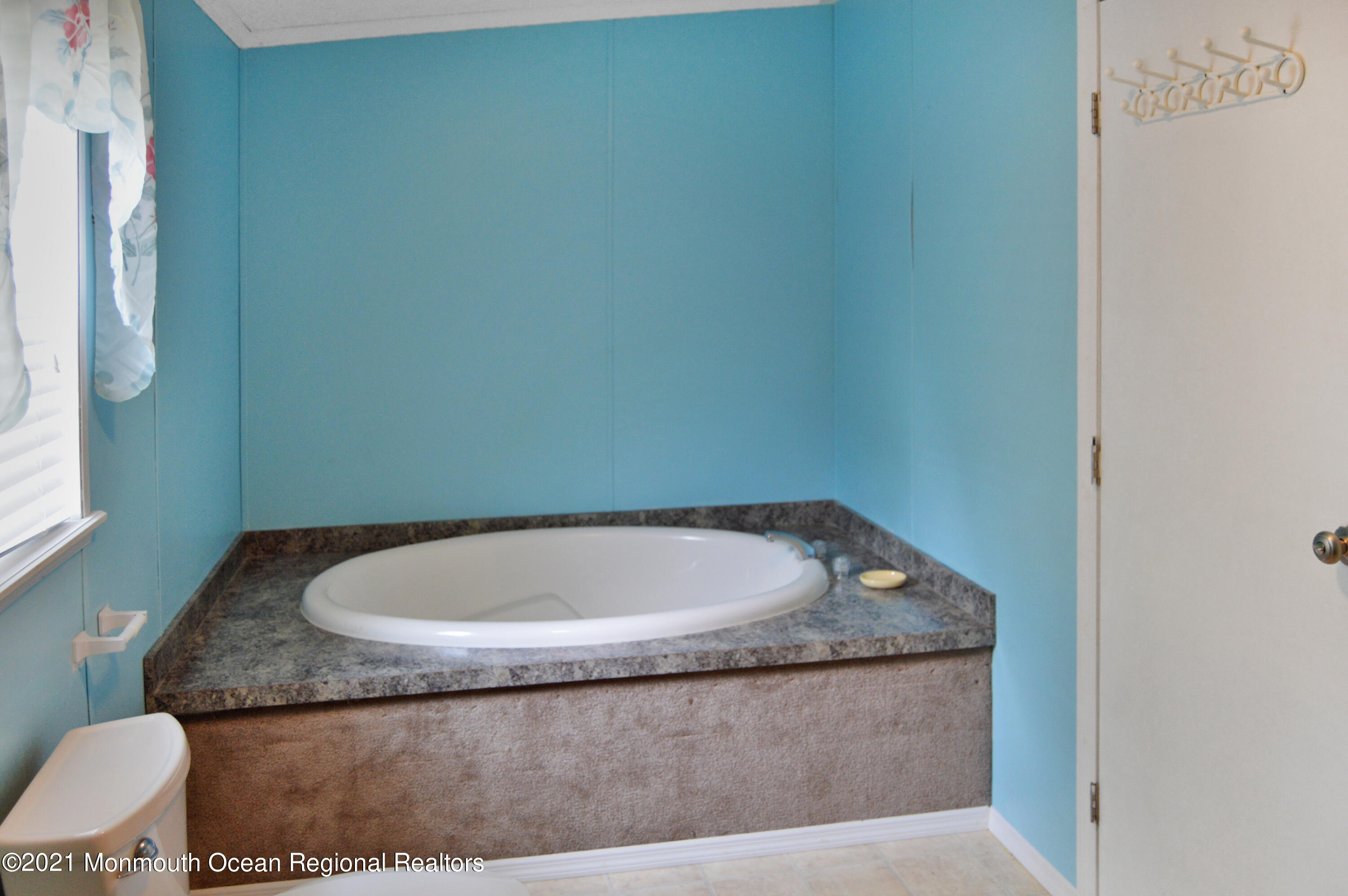 50 Roberts Road Toms River, NJ 08755 - Photo 20 of 23 a bathroom with a granite countertop sink and a mirror
