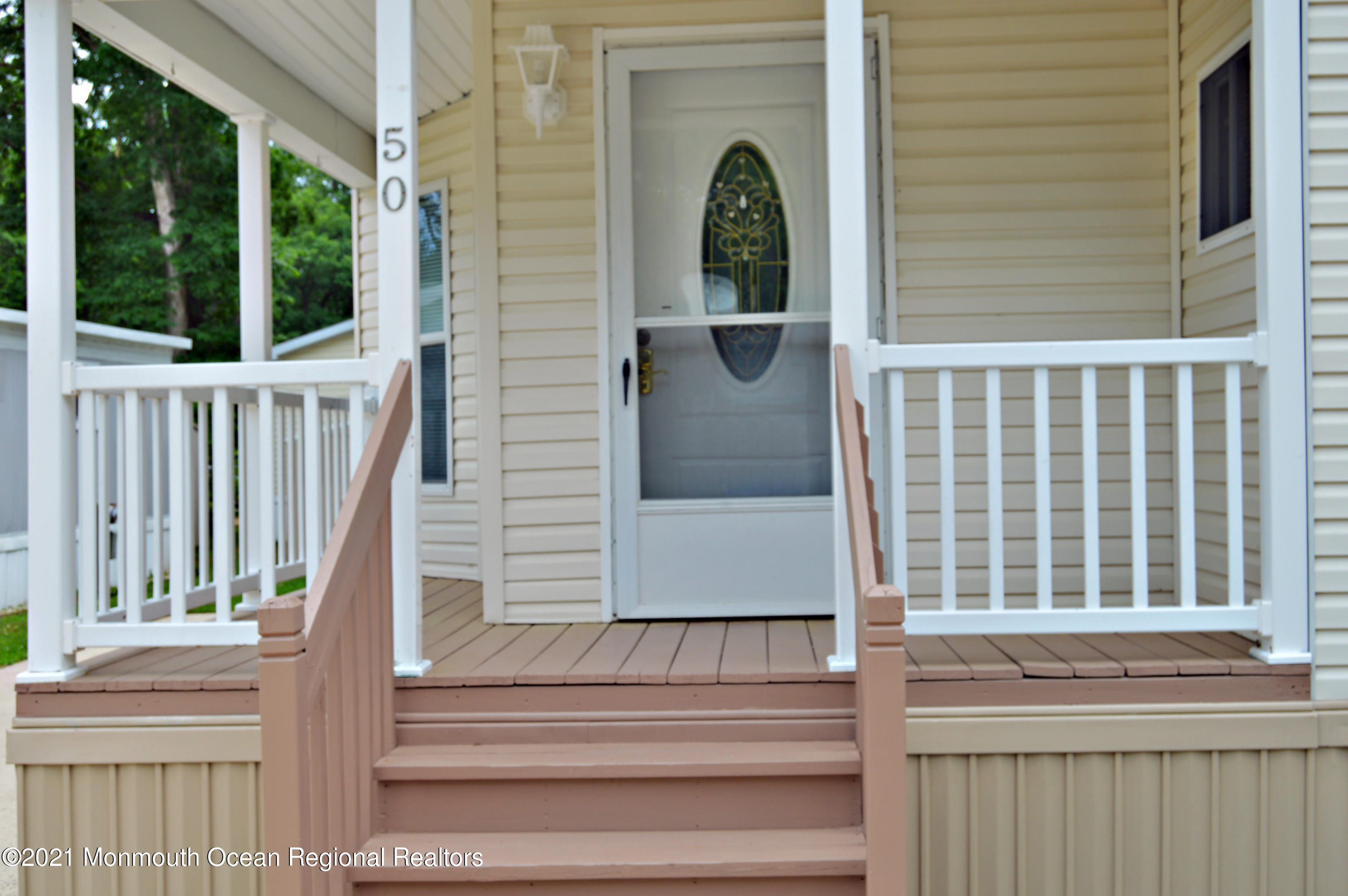 50 Roberts Road Toms River, NJ 08755 - Photo 3 of 23 a view of entrance gate and wooden door