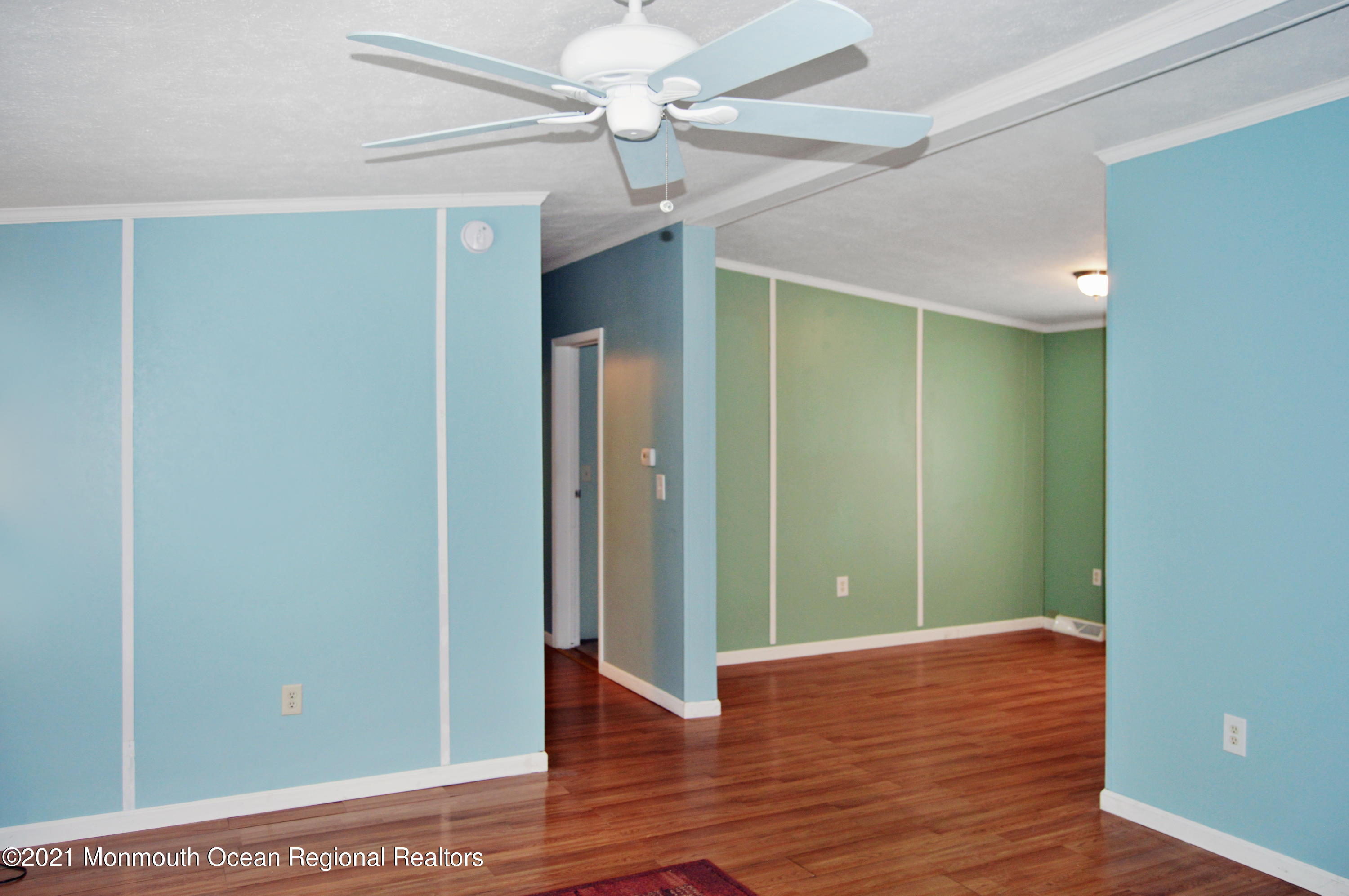 50 Roberts Road Toms River, NJ 08755 - Photo 5 of 23 a view of an empty room with wooden floor