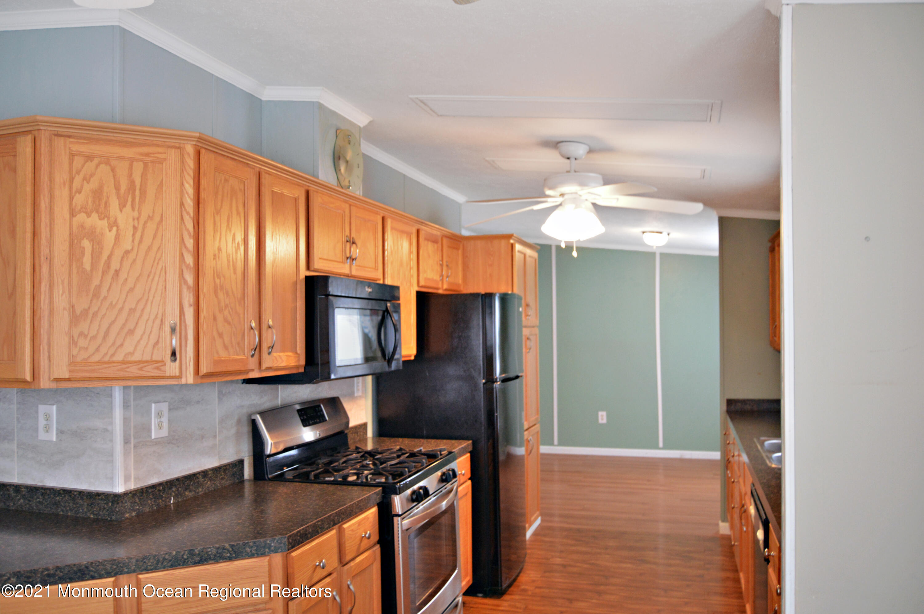 50 Roberts Road Toms River, NJ 08755 - Photo 7 of 23 a kitchen with stainless steel appliances granite countertop a stove refrigerator and cabinets