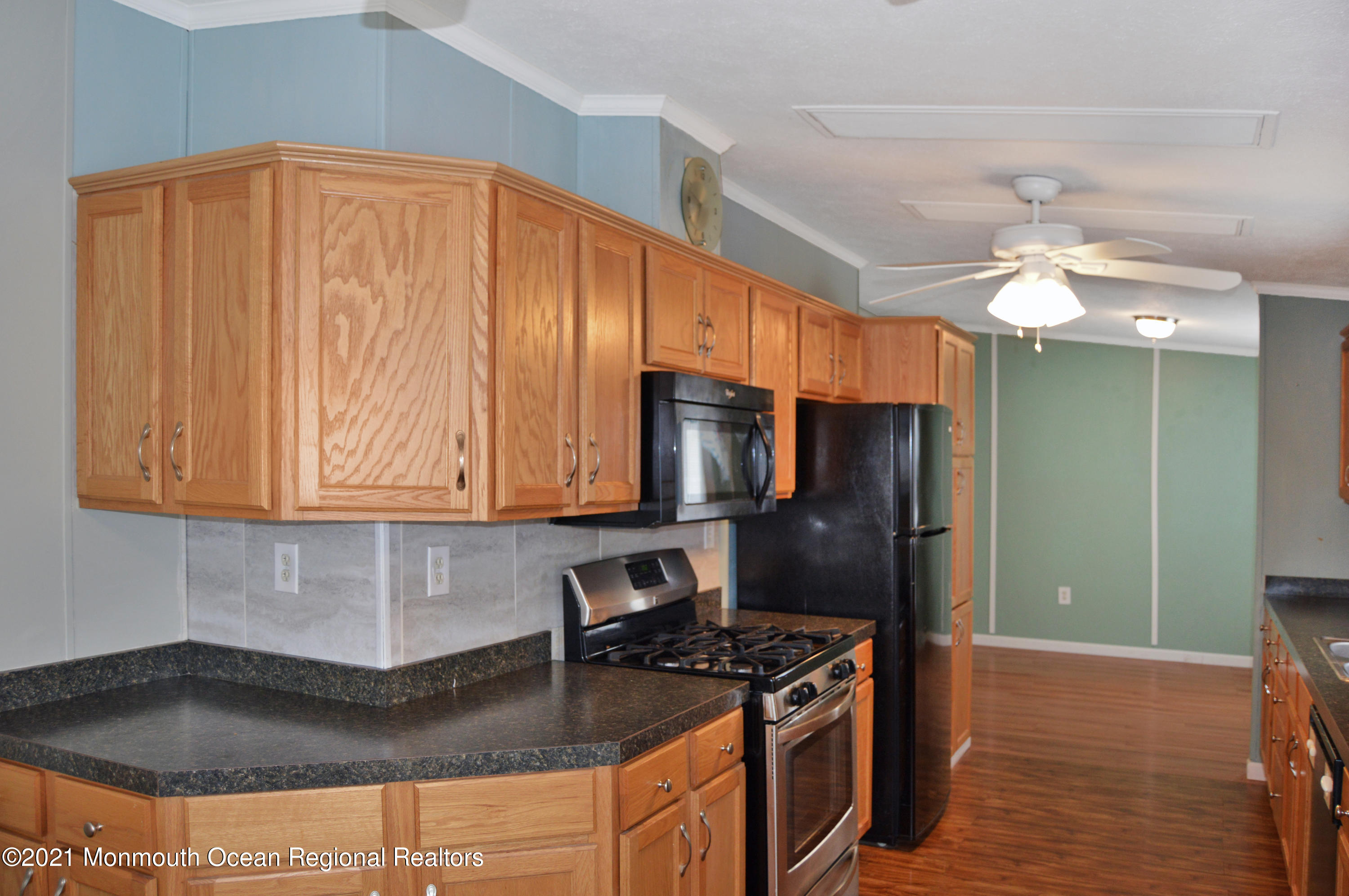 50 Roberts Road Toms River, NJ 08755 - Photo 8 of 23 a kitchen with stainless steel appliances granite countertop a refrigerator a stove and a sink