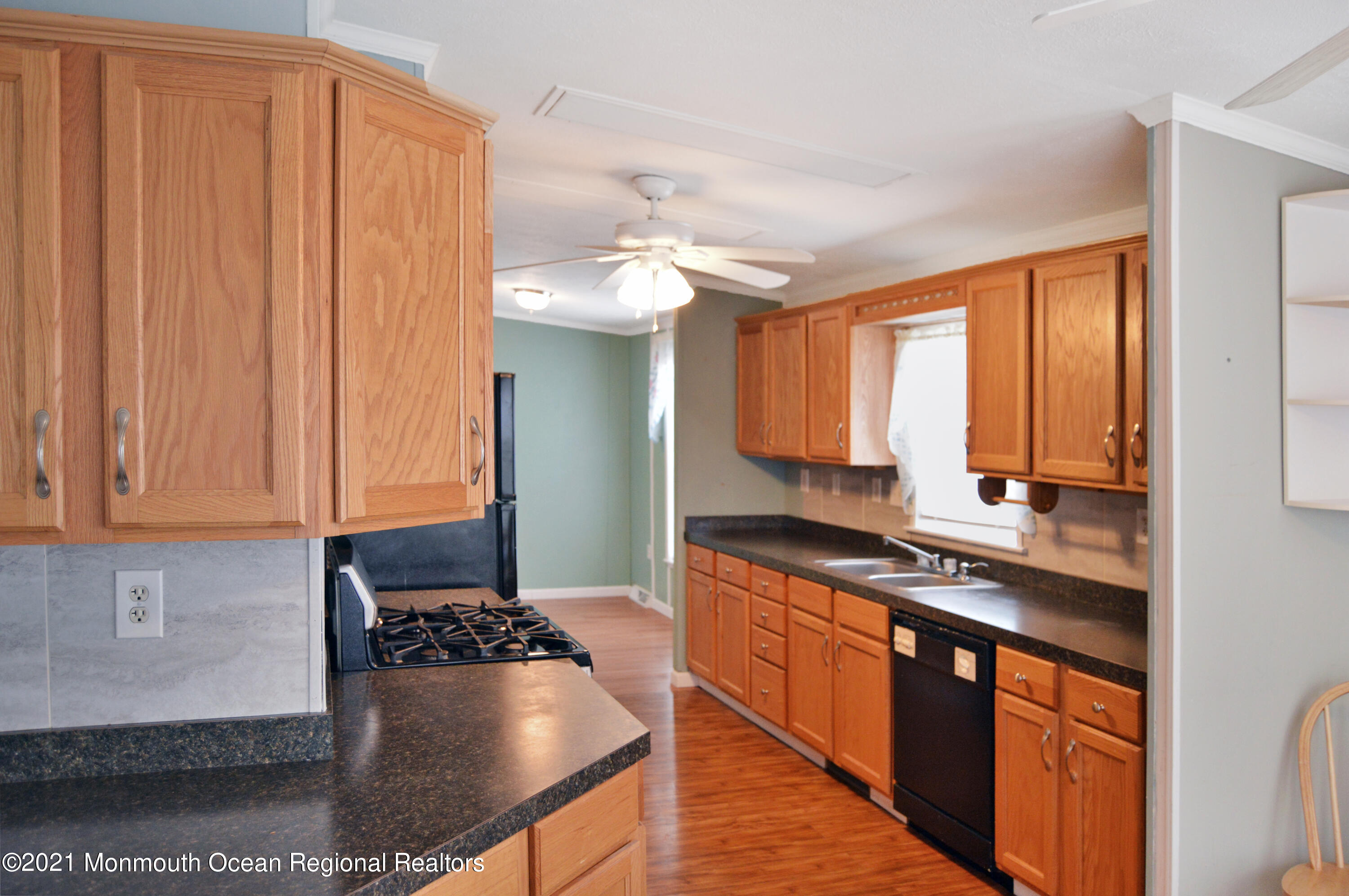 50 Roberts Road Toms River, NJ 08755 - Photo 10 of 23 a kitchen with stainless steel appliances granite countertop a sink stove and refrigerator