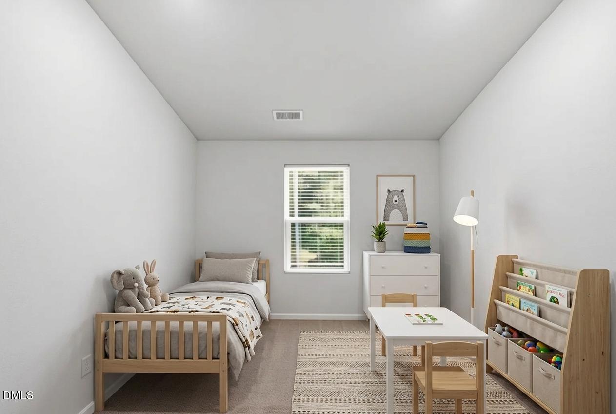 90 Everglade Way Angier, NC 27501 - Photo 6 of 36 a bedroom with furniture and a window