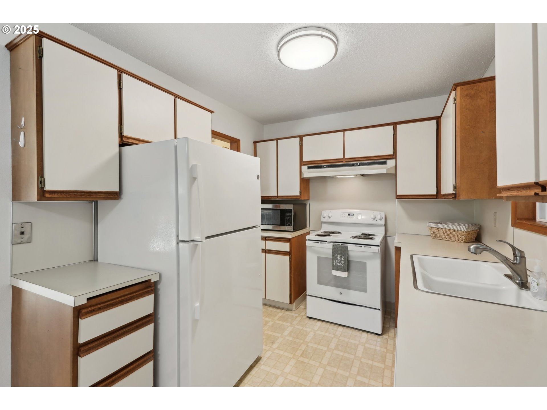 12325 Southeast Main Street Portland, OR 97233 - Photo 15 of 46 a kitchen with a refrigerator sink and stove