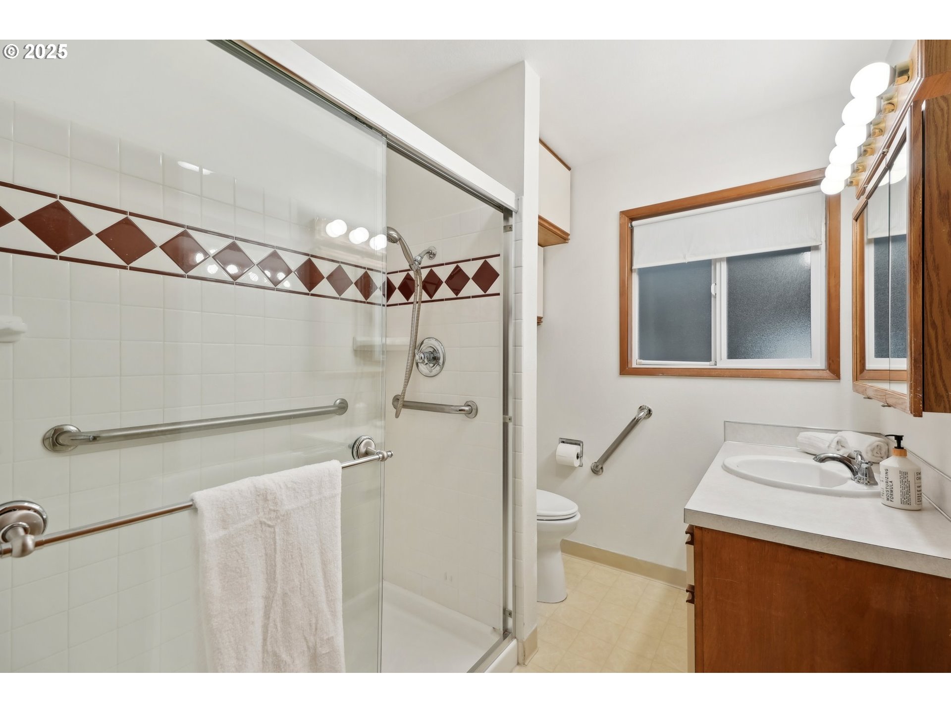 12325 Southeast Main Street Portland, OR 97233 - Photo 18 of 46 a bathroom with a sink mirror and a shower
