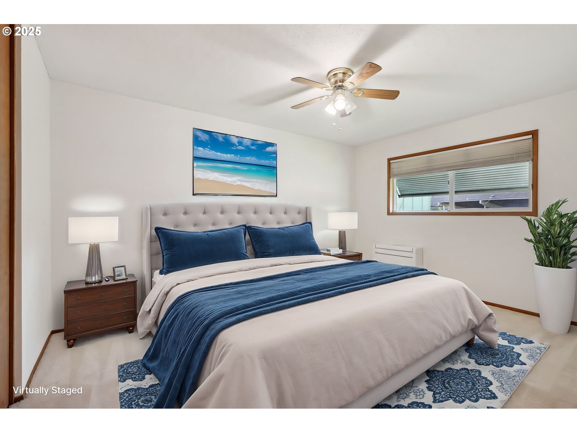 12325 Southeast Main Street Portland, OR 97233 - Photo 20 of 46 a bedroom with a bed and a chandelier