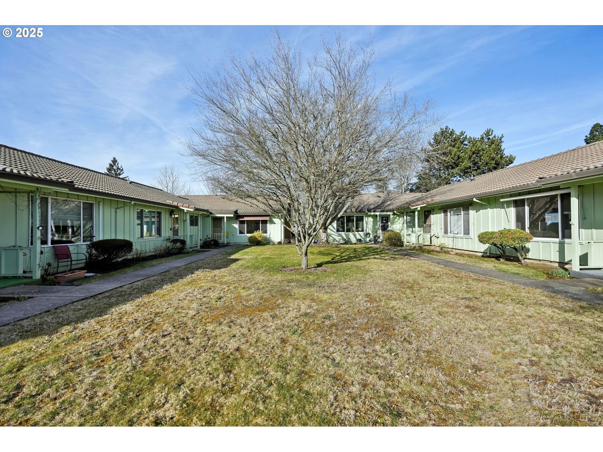 12325 Southeast Main Street Portland, OR 97233 - Photo 2 of 46 a view of a house with a yard