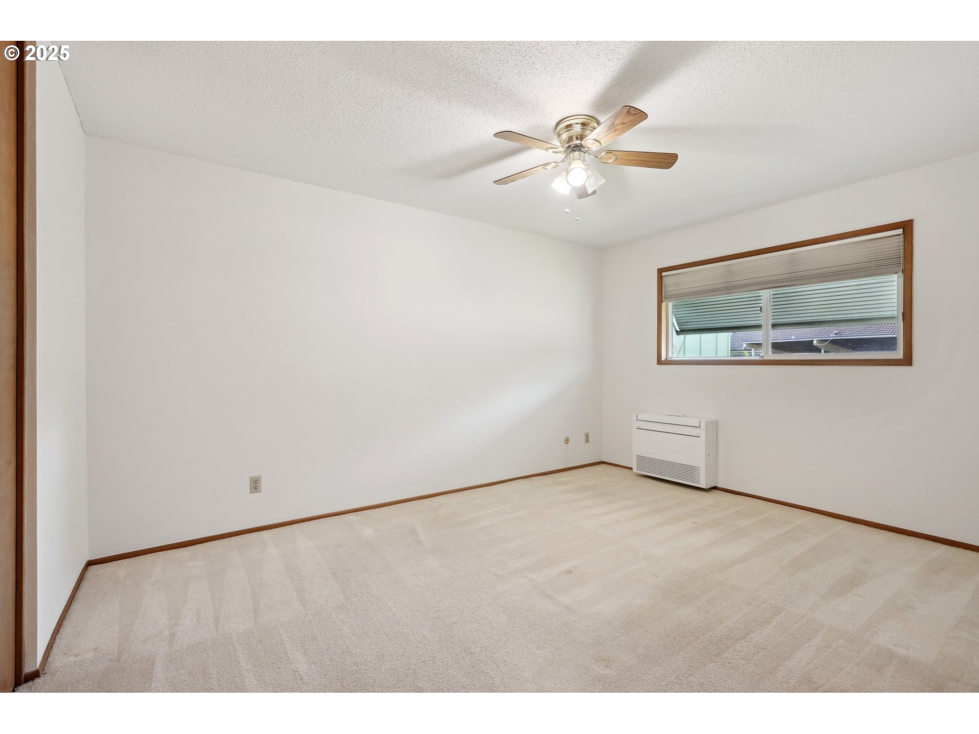 12325 Southeast Main Street Portland, OR 97233 - Photo 21 of 46 a view of an empty room with a window