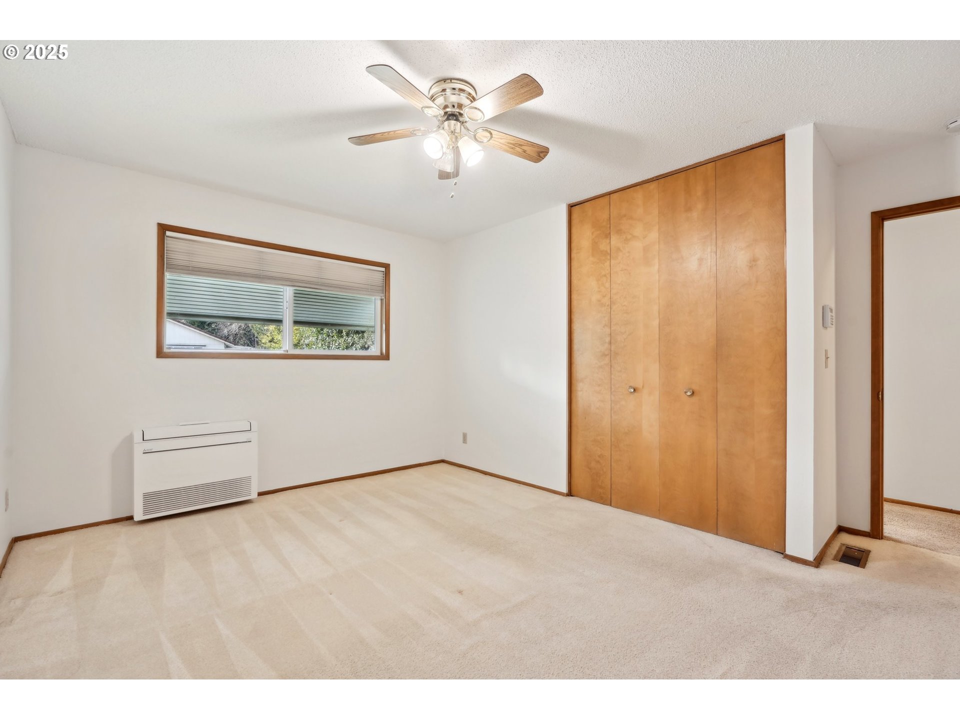 12325 Southeast Main Street Portland, OR 97233 - Photo 23 of 46 a view of an empty room with wooden floor