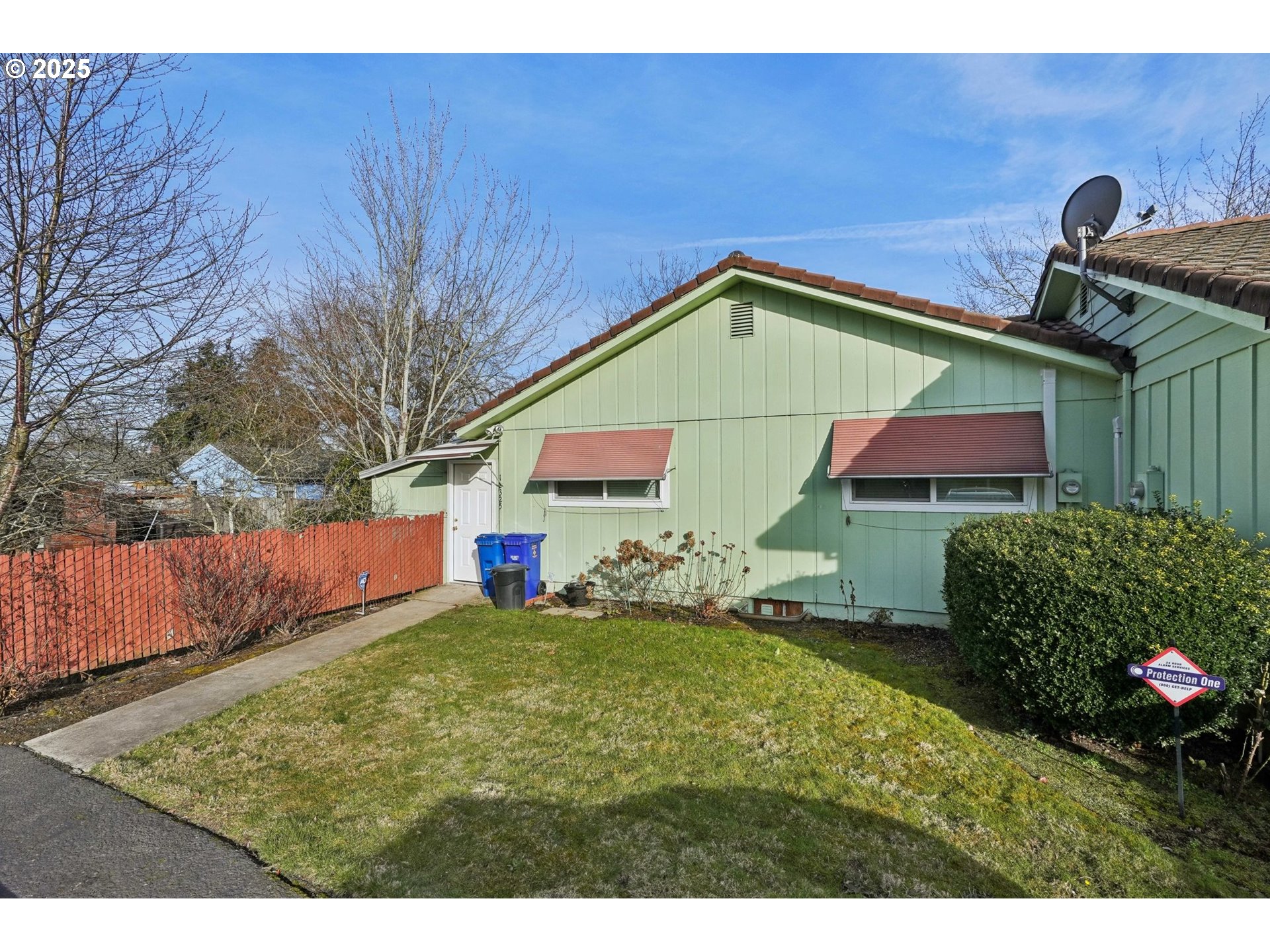 12325 Southeast Main Street Portland, OR 97233 - Photo 30 of 46 a view of a house with a yard and plants