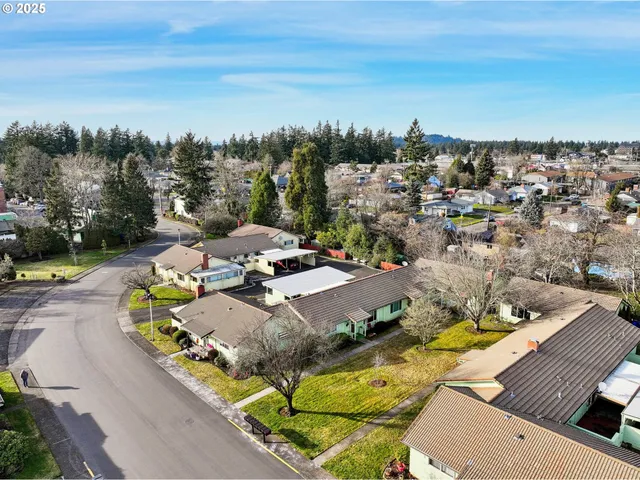 an aerial view of a house with outdoor space