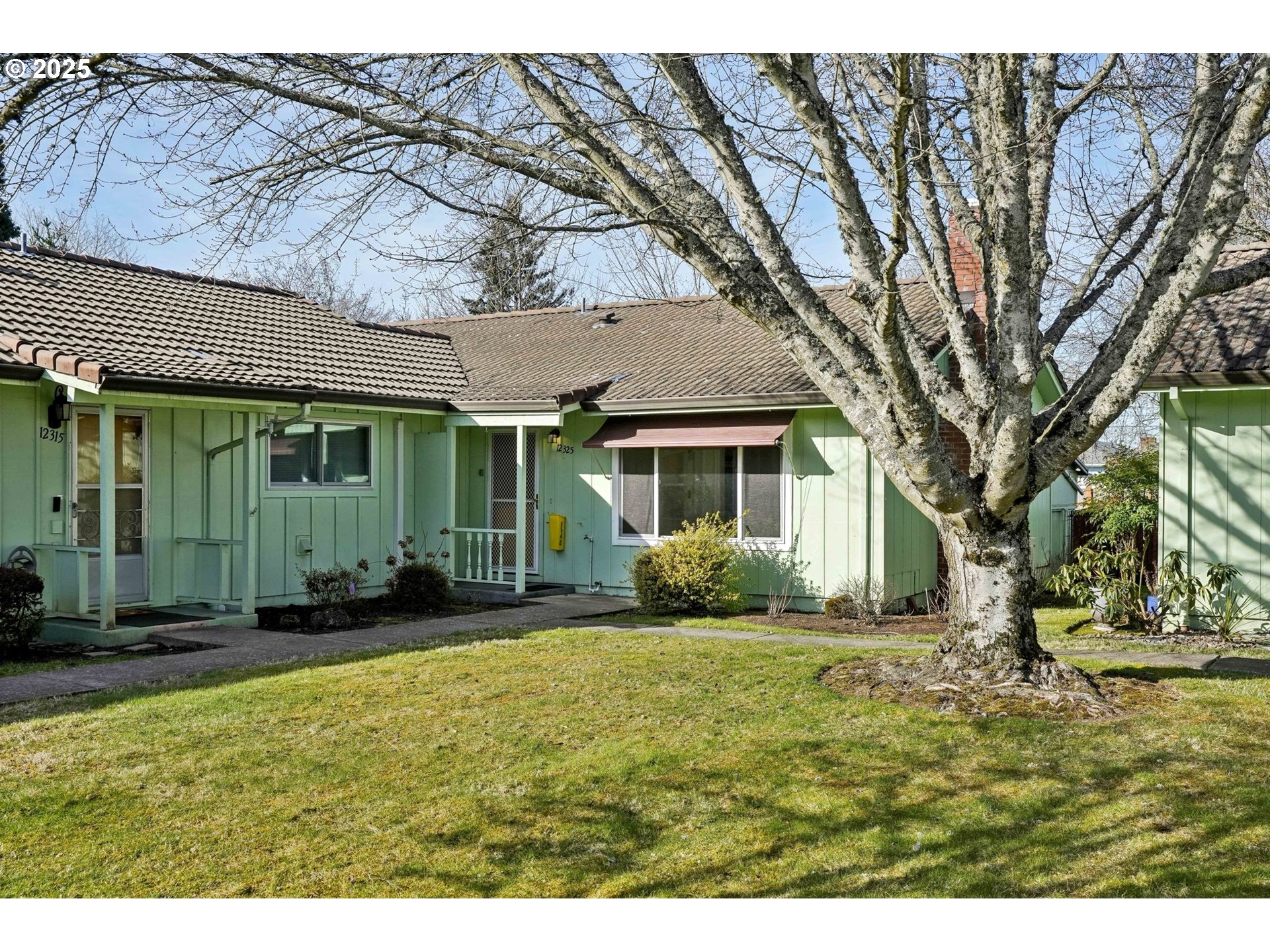 12325 Southeast Main Street Portland, OR 97233 - Photo 4 of 46 a view of a house with a yard