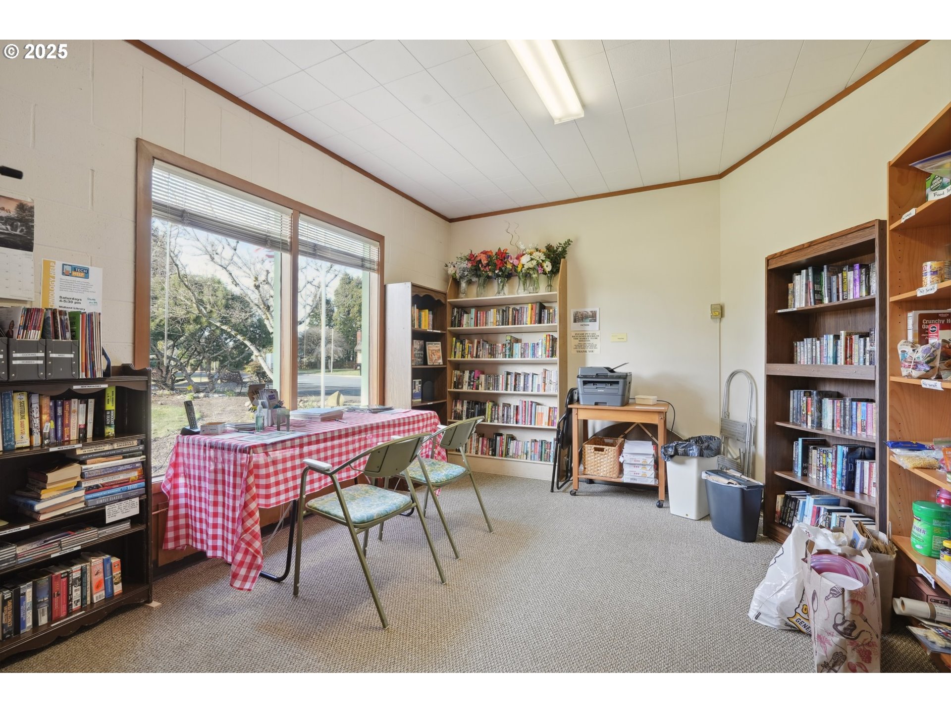 12325 Southeast Main Street Portland, OR 97233 - Photo 43 of 46 a living room with furniture a bookshelf and a window
