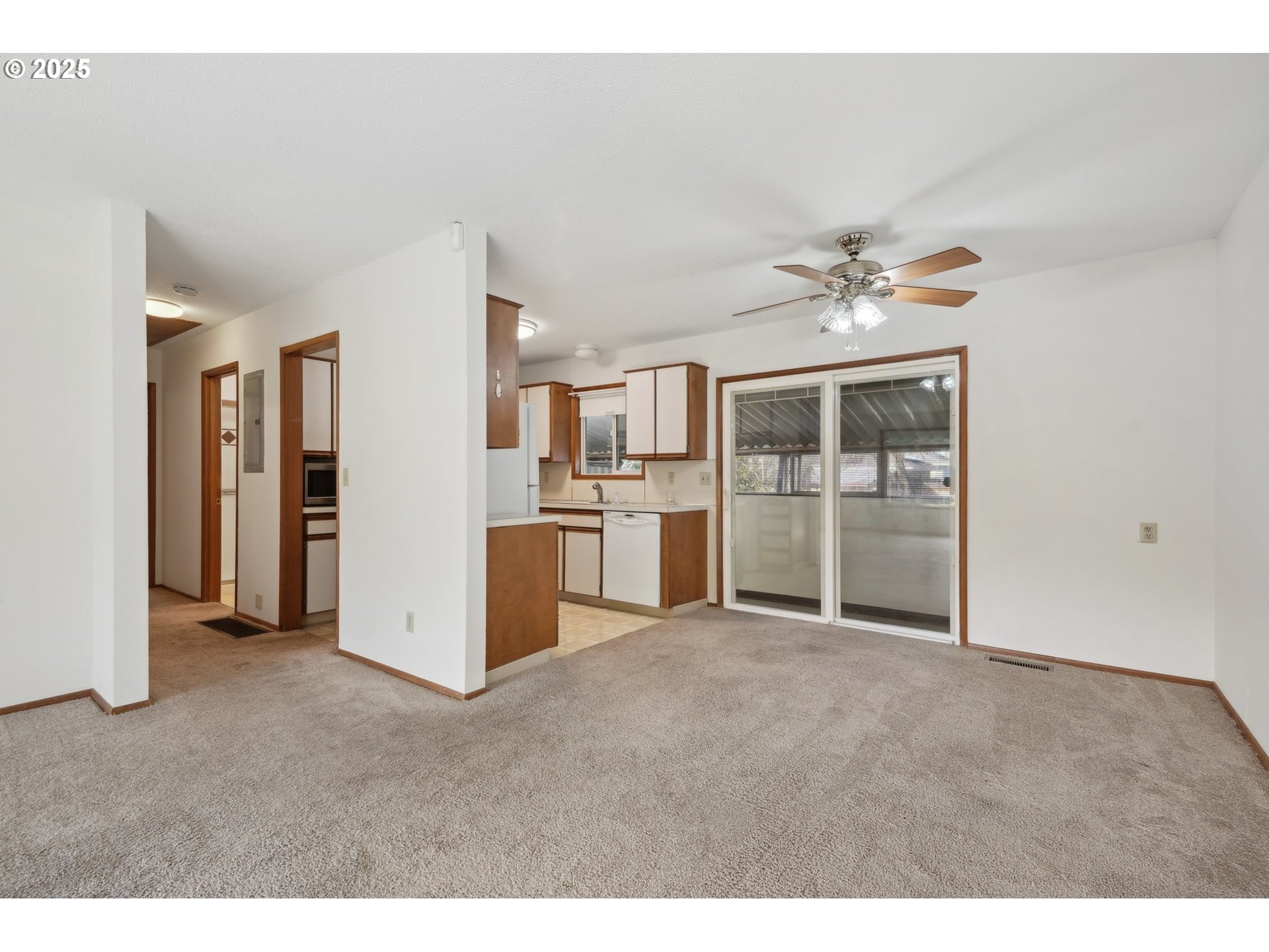 12325 Southeast Main Street Portland, OR 97233 - Photo 10 of 46 a view of a kitchen with refrigerator and a sink