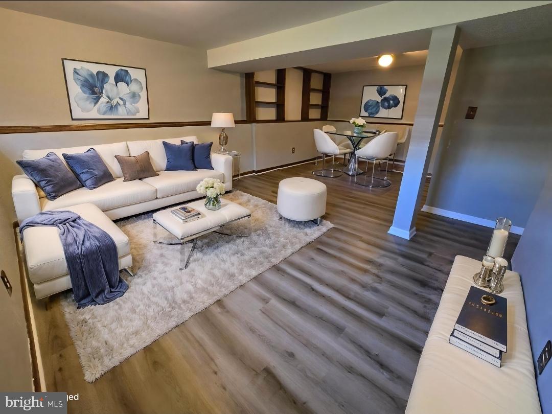 5040 Clifford Road, Unit 5040 Perry Hall, MD 21128 - Photo 13 of 19 a living room with furniture and wooden floor